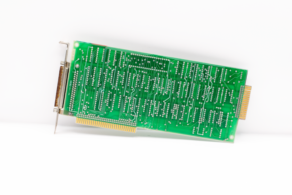A detailed view of a vintage circuit board showcasing intricate electronic connections.