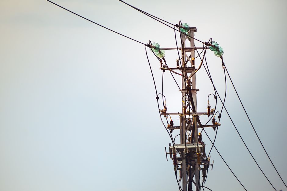 Close-up of high voltage power lines against the sky in Kunming, Yunnan, China.