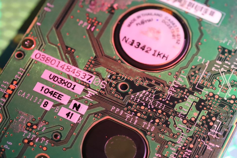 Detailed close-up of a computer circuit board highlighting components and electronic paths.