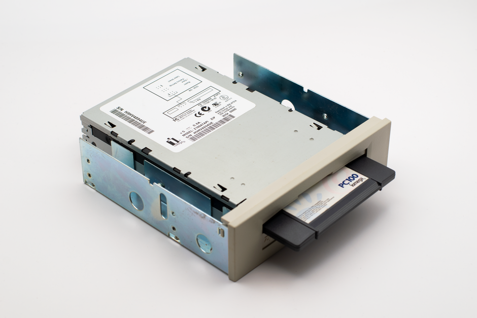An old-fashioned PC100 data backup drive with a removable diskette, showcasing retro computing hardware.