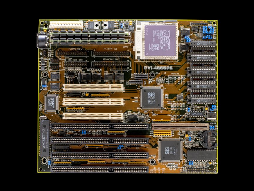 Detailed close-up of a vintage motherboard showcasing electronic circuits and components.