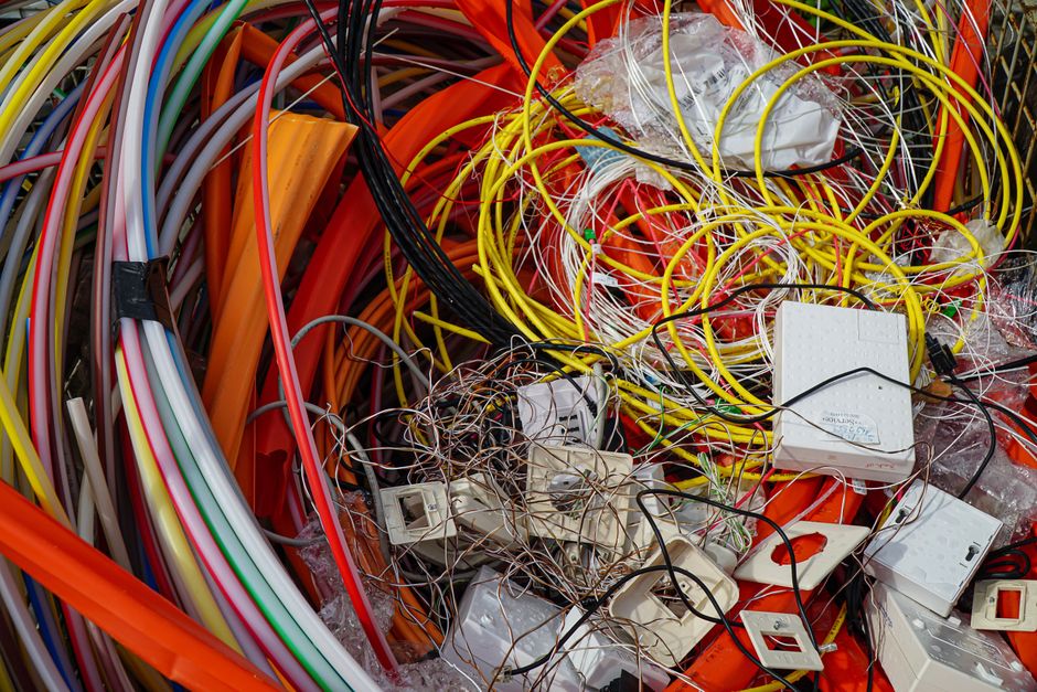 A vibrant mixture of electrical cables and waste ready for recycling.
